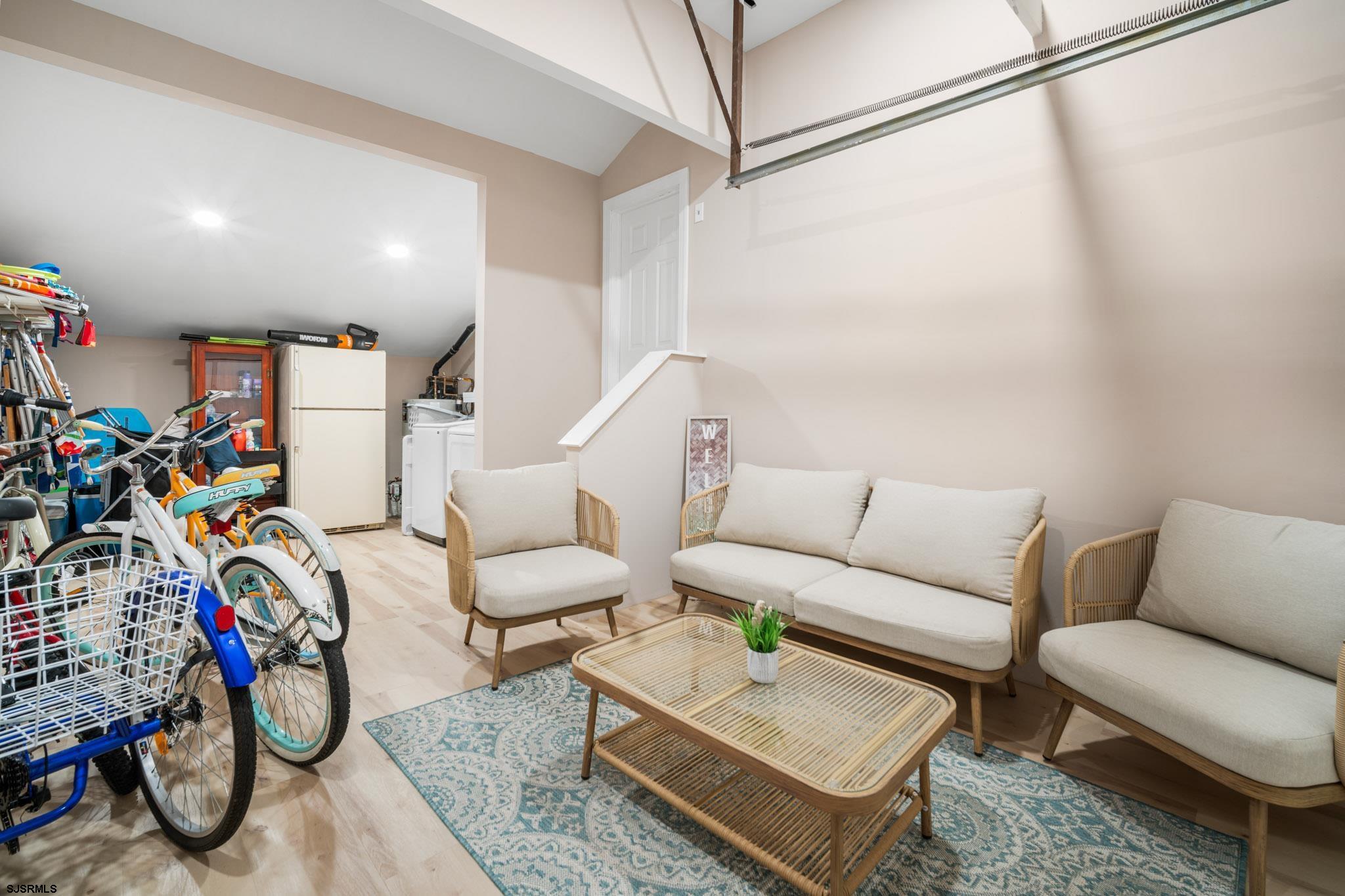 10 Explorer Road Brigantine, NJ 08203 - Photo 26 of 39 a living room with furniture and a flat screen tv