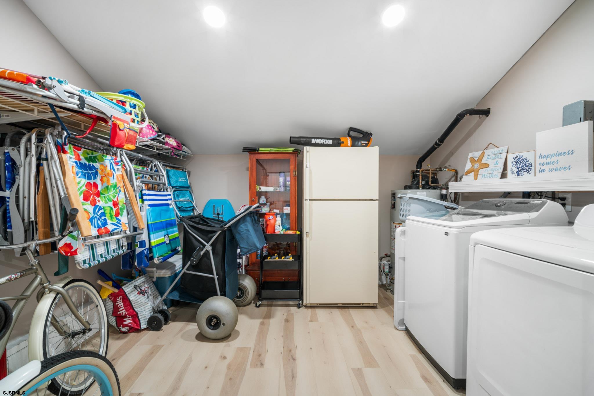 10 Explorer Road Brigantine, NJ 08203 - Photo 28 of 39 a storage room with washer and dryer