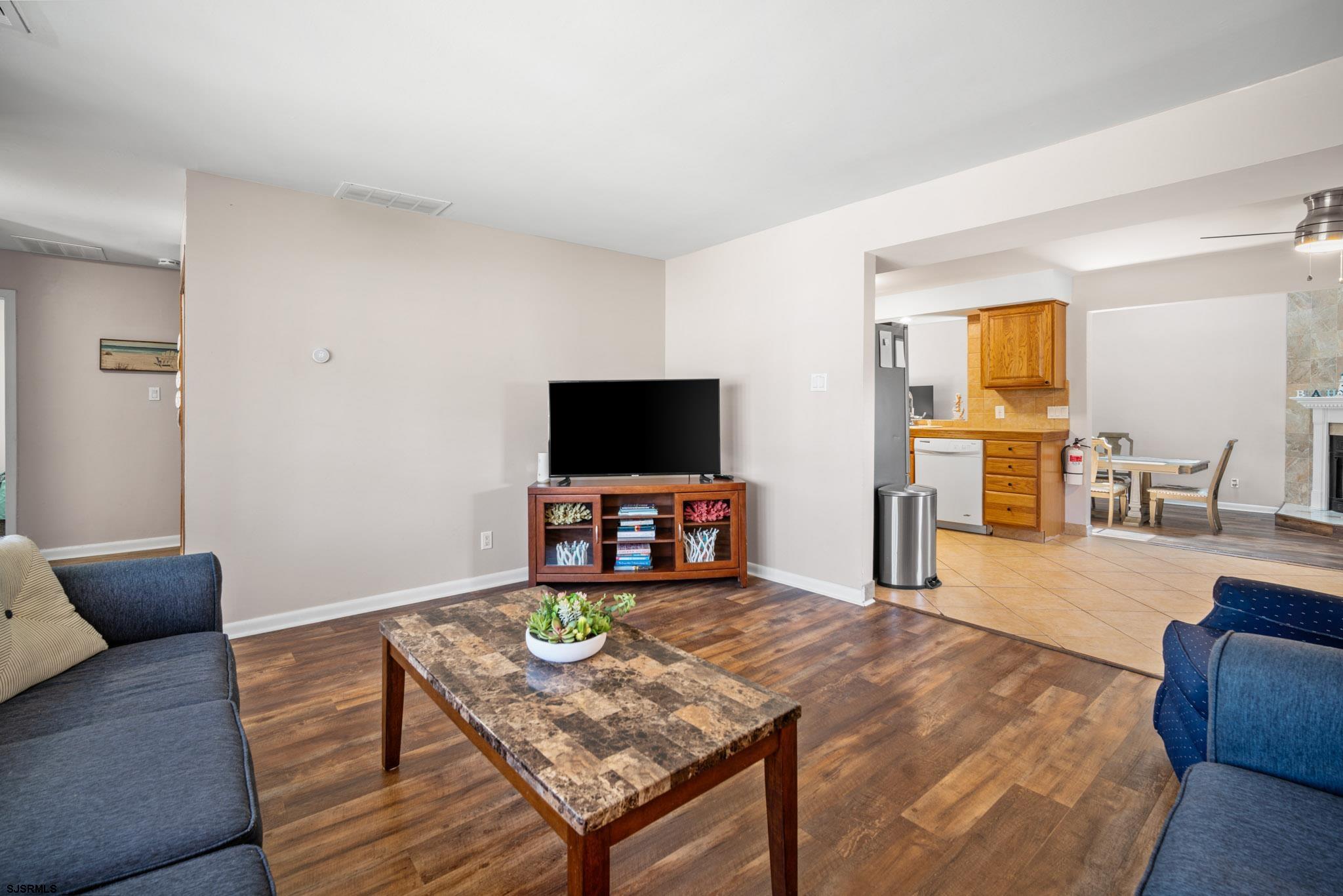 10 Explorer Road Brigantine, NJ 08203 - Photo 5 of 39 a living room with furniture and a flat screen tv