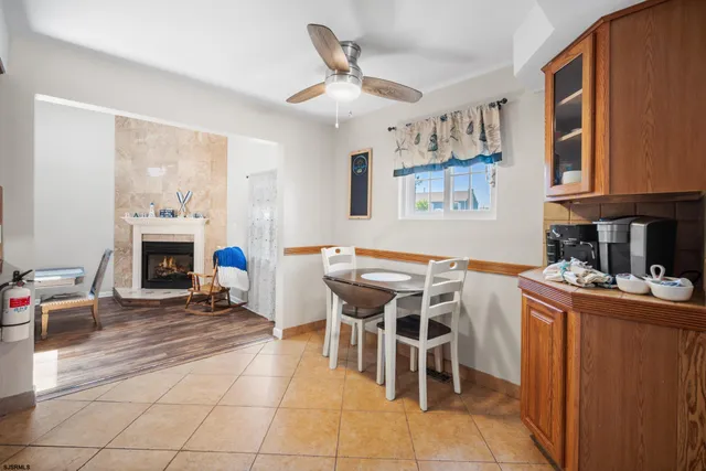 a dining room with furniture and a fireplace