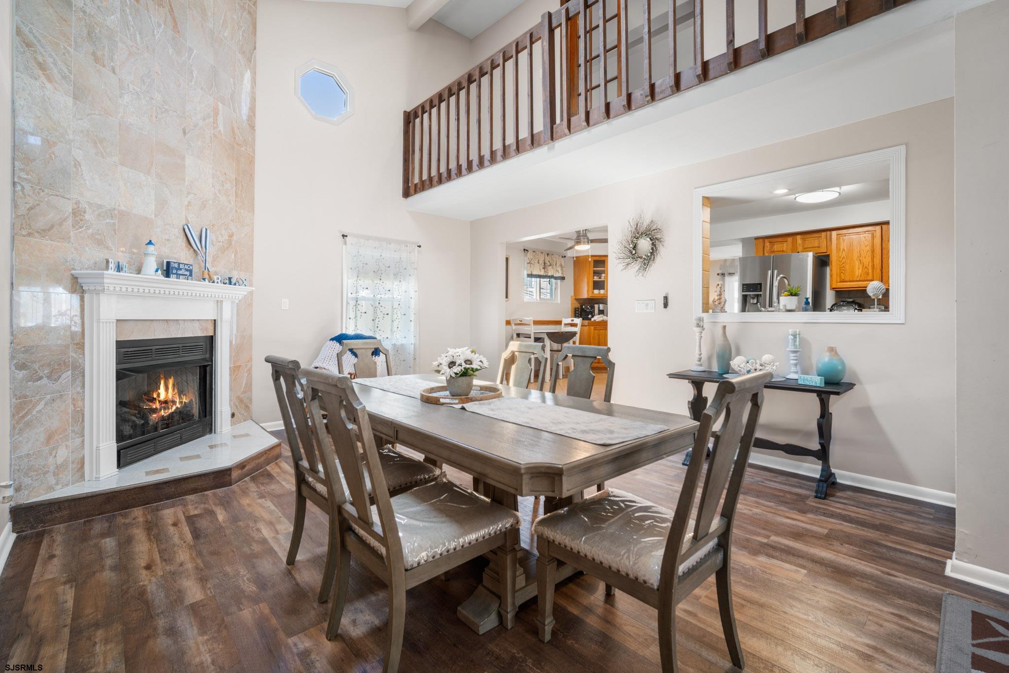 10 Explorer Road Brigantine, NJ 08203 - Photo 10 of 39 a view of a dining room with furniture and wooden floor