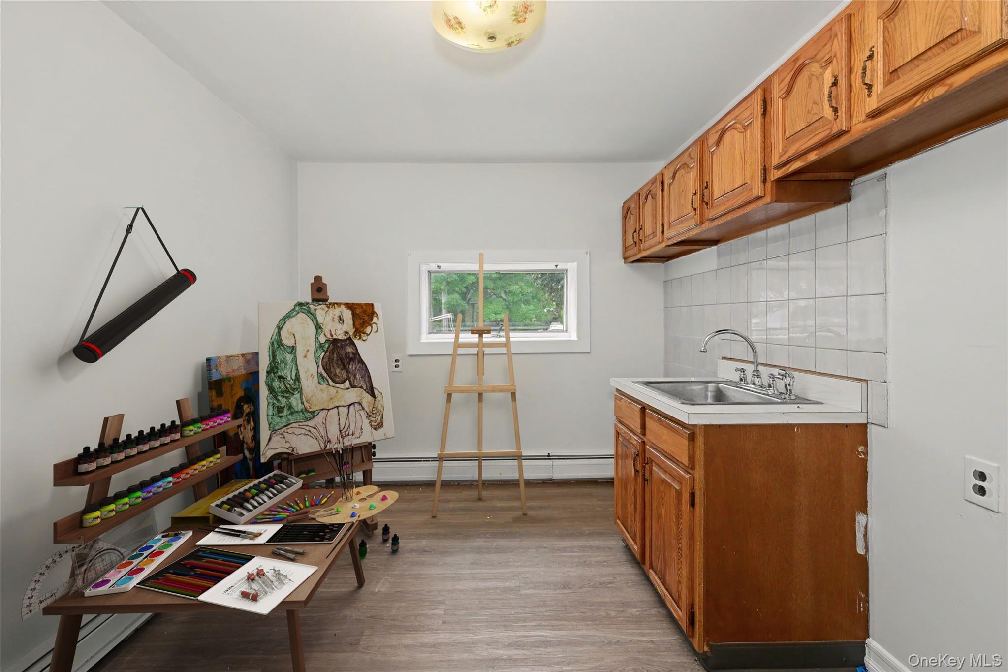 568 Manville Road, Unit UPPER R Pleasantville, NY 10570 - Photo 28 of 32 Virtually staged artist studio. Can be set up as a mud room as a door (unseen) on the left leads to the 1Car Garage.