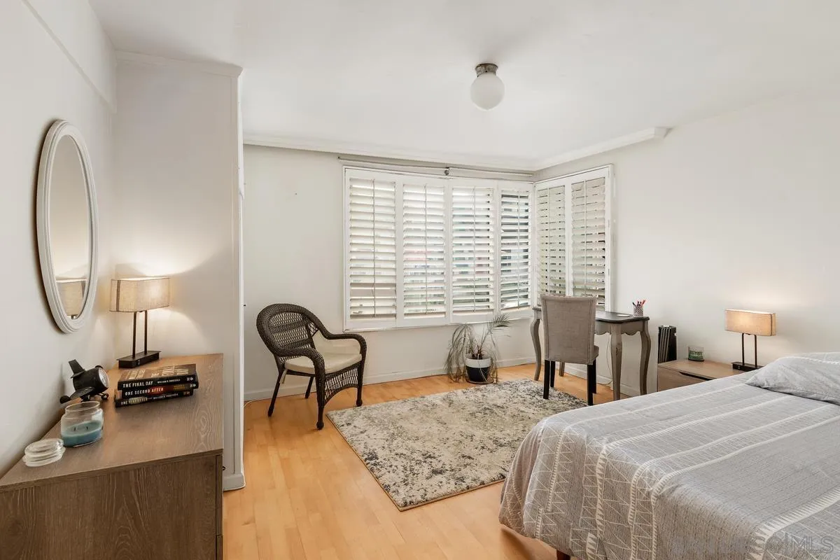 8040 Girard Avenue, Unit 2 La Jolla, CA 92037 - Photo 11 of 17 a view of a bedroom with furniture and a window