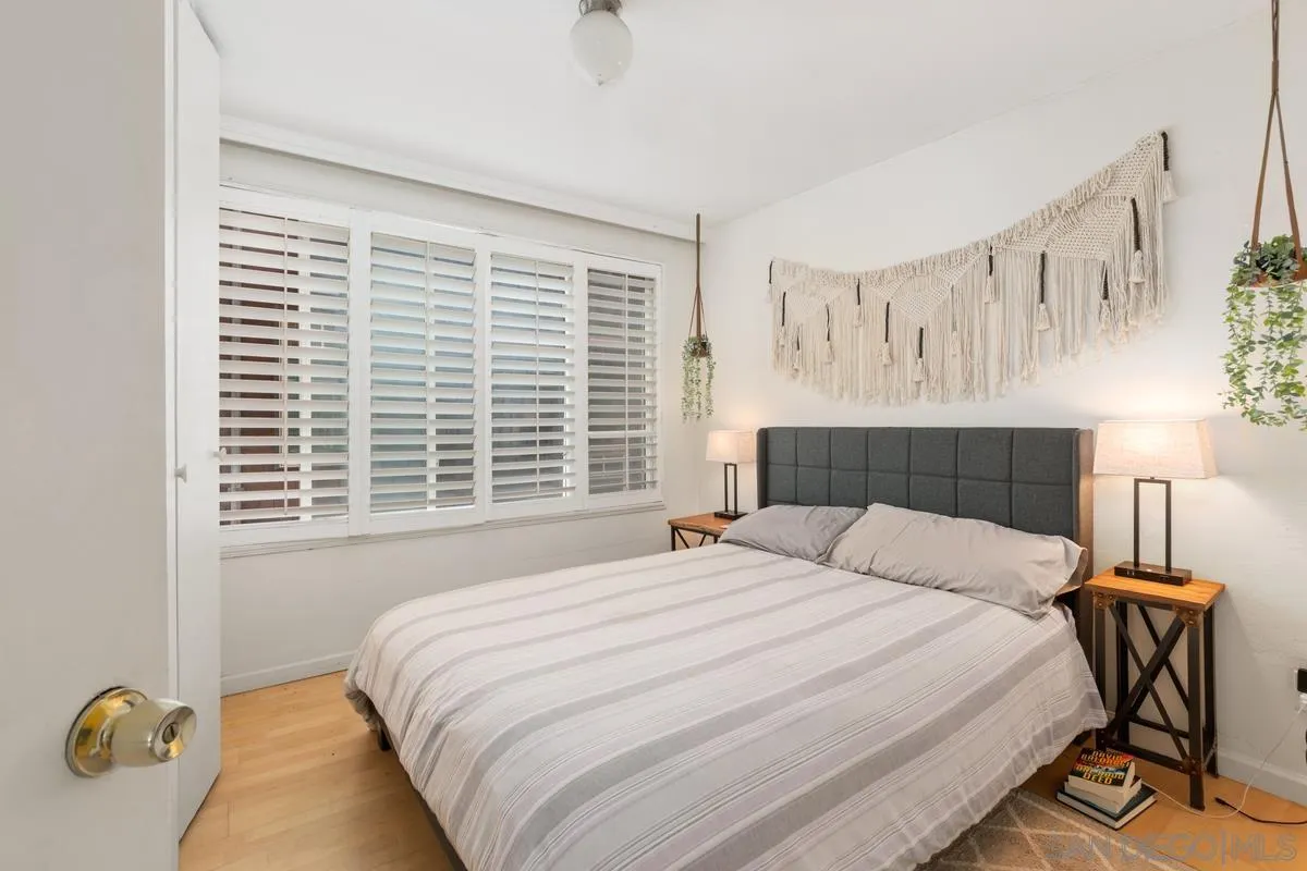 8040 Girard Avenue, Unit 2 La Jolla, CA 92037 - Photo 15 of 17 a bedroom with a bed and a table