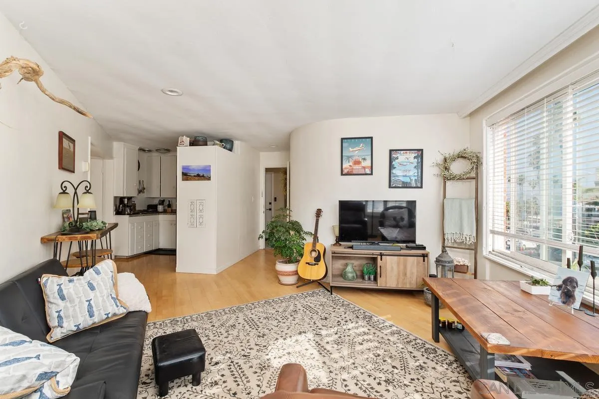 8040 Girard Avenue, Unit 2 La Jolla, CA 92037 - Photo 2 of 17 a living room with furniture and a flat screen tv