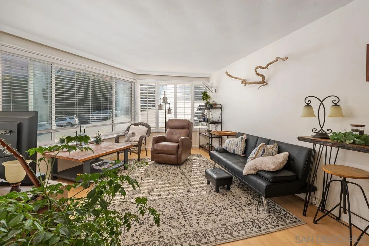 8040 Girard Avenue, Unit 2 La Jolla, CA 92037 - Photo 6 of 17 a living room with furniture and a large window