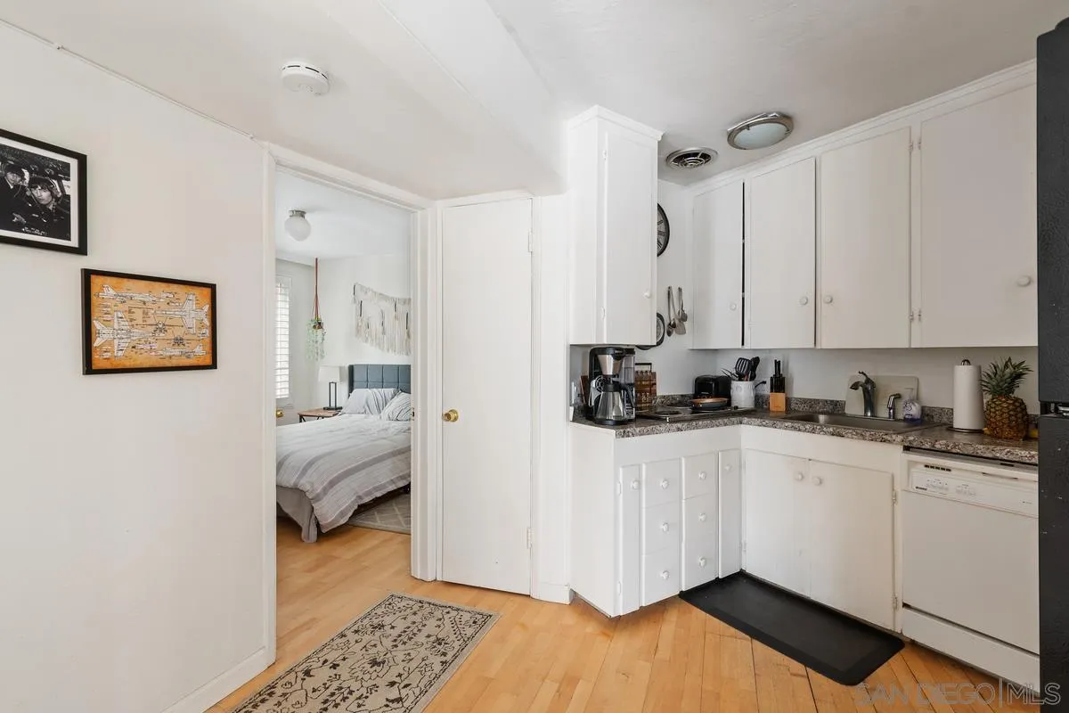 8040 Girard Avenue, Unit 2 La Jolla, CA 92037 - Photo 8 of 17 a kitchen with a sink and cabinets