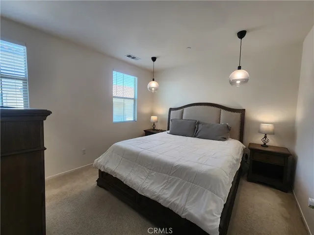 a bedroom with a bed and a closet