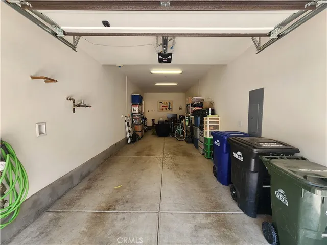 a view of a livingroom with furniture and bookshelf