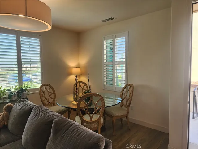 a view of a livingroom with furniture and a window