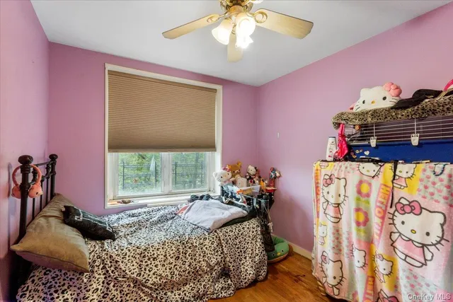 a bed room with a bed and a window