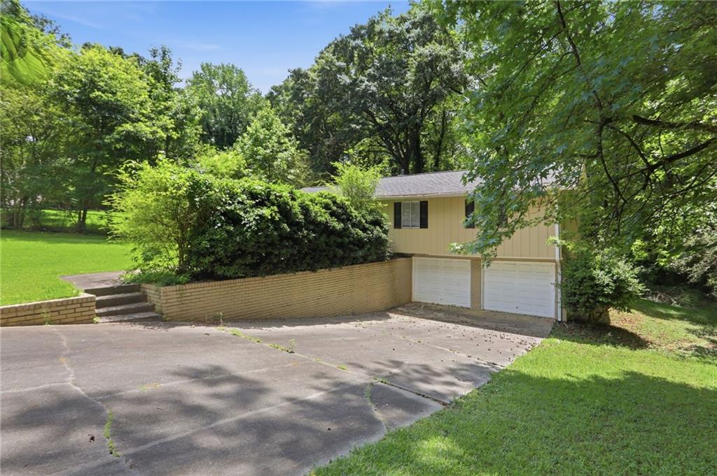 4505 Wonder Valley Trail Decatur, GA 30034 - Photo 2 of 34 a view of a yard with a house