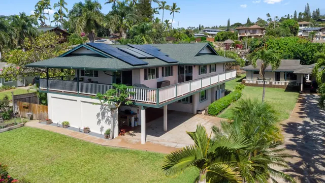 a view of a balcony with chairs and wooden floor