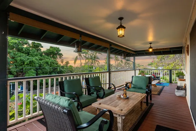 a view of a balcony with chairs