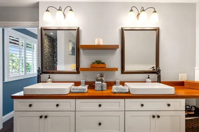 a bathroom with a sink double vanity granite and a sink