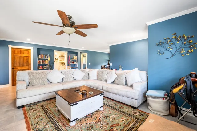 a view of a dining room with furniture and a kitchen