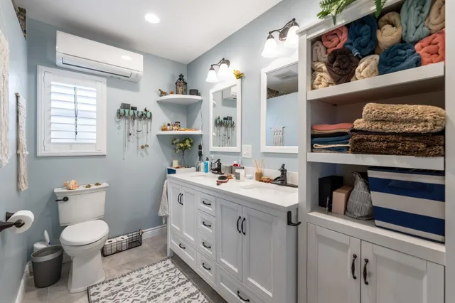 a bathroom with a shower curtain and a sink