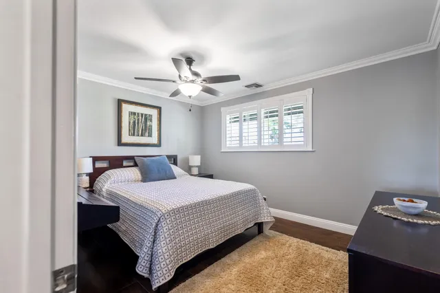 a bathroom with a toilet a sink and a mirror
