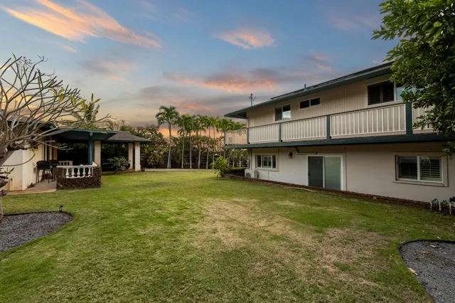 a view of a backyard of the house