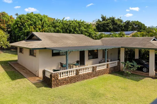 a kitchen with stainless steel appliances granite countertop a stove a sink dishwasher and cabinets with wooden floor