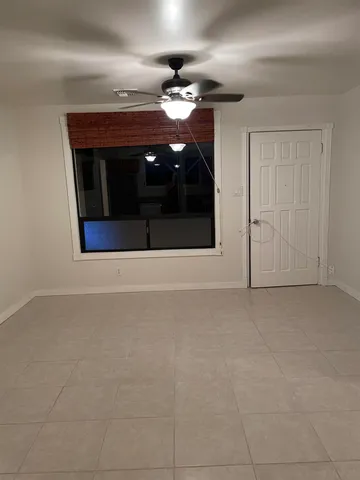 an aerial view of a house with a swimming pool yard and outdoor seating