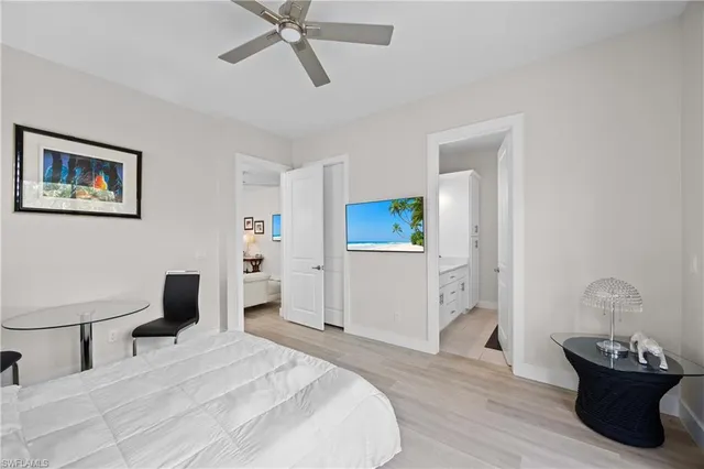 a bedroom with a bed and a table