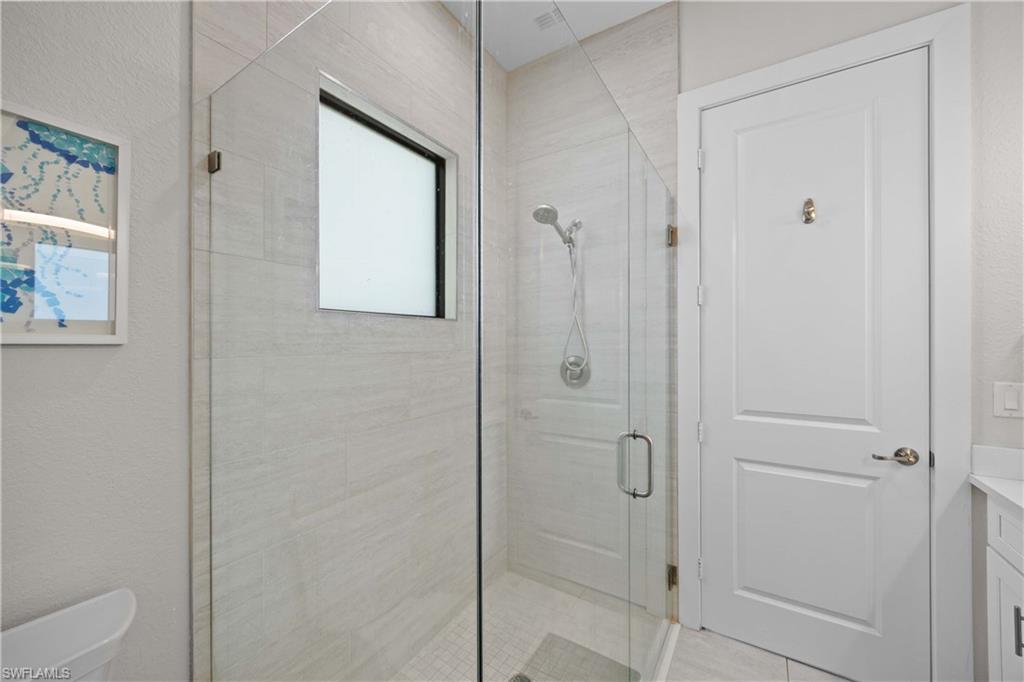 5832 Jasper Way, Unit 5102 Naples, FL 34114 - Photo 21 of 24 a bathroom with a shower