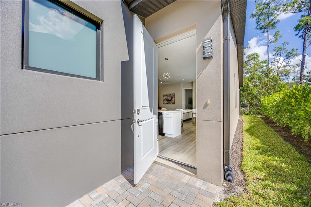 5832 Jasper Way, Unit 5102 Naples, FL 34114 - Photo 24 of 24 a view of a hallway with a living room