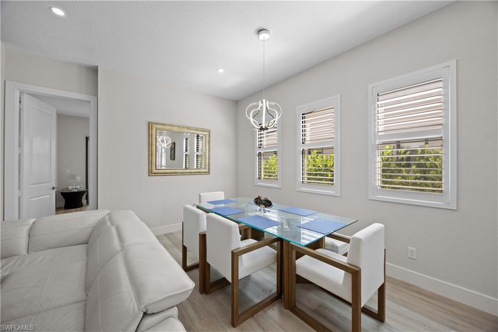 5832 Jasper Way, Unit 5102 Naples, FL 34114 - Photo 7 of 24 a workspace with furniture and window