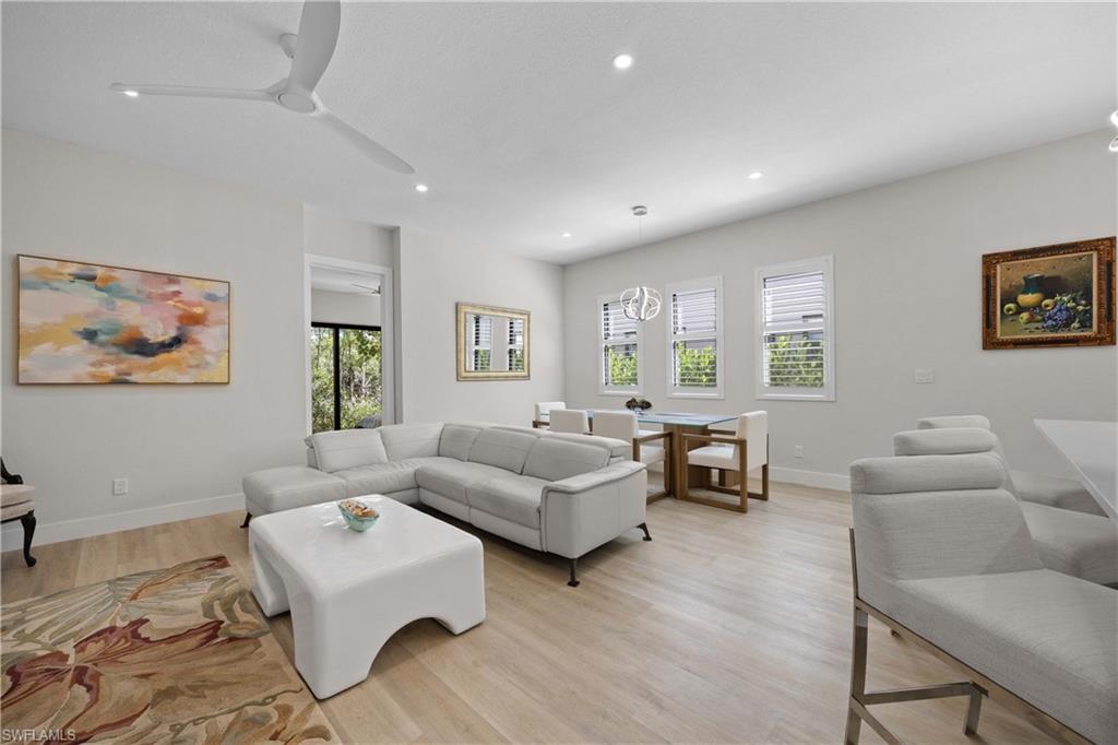 5832 Jasper Way, Unit 5102 Naples, FL 34114 - Photo 10 of 24 a living room with furniture and a window