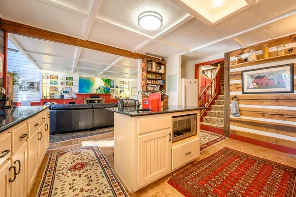 a view of a room with wooden floor