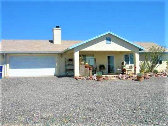 3481 Topaz Road Golden Valley, AZ 86413 - Photo 1 of 12 a view of a house with backyard porch and sitting area