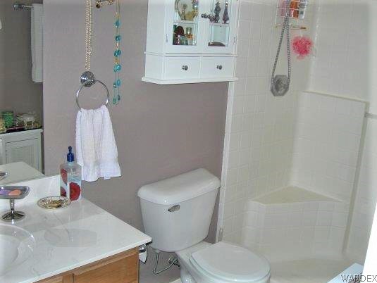 3481 Topaz Road Golden Valley, AZ 86413 - Photo 11 of 12 a bathroom with a sink toilet and shower