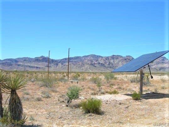 3481 Topaz Road Golden Valley, AZ 86413 - Photo 3 of 12 a view of a lake from a yard