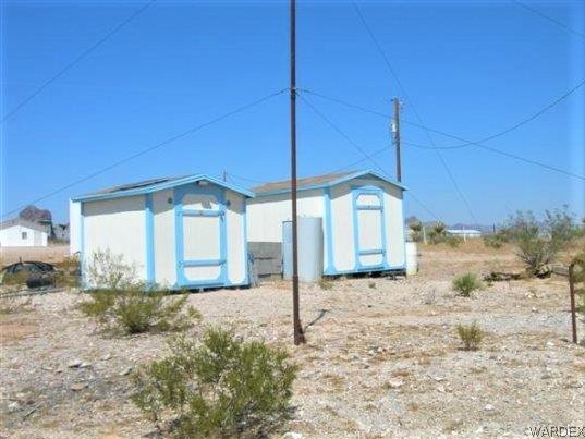 3481 Topaz Road Golden Valley, AZ 86413 - Photo 4 of 12 a view of a house with a yard