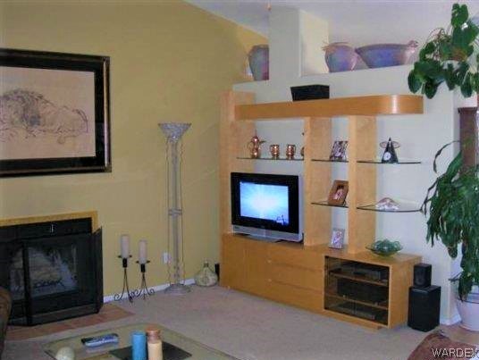 3481 Topaz Road Golden Valley, AZ 86413 - Photo 7 of 12 a room with fireplace and wooden floor