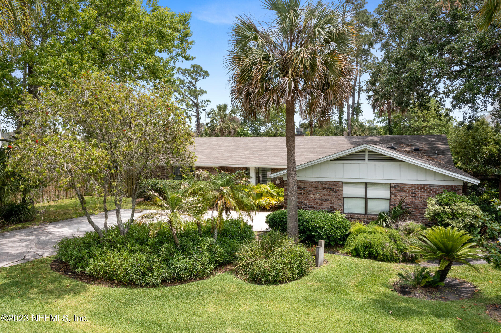 1 Hopson Road Jacksonville Beach, FL 32250 - Photo 1 of 58 a house with trees in the background
