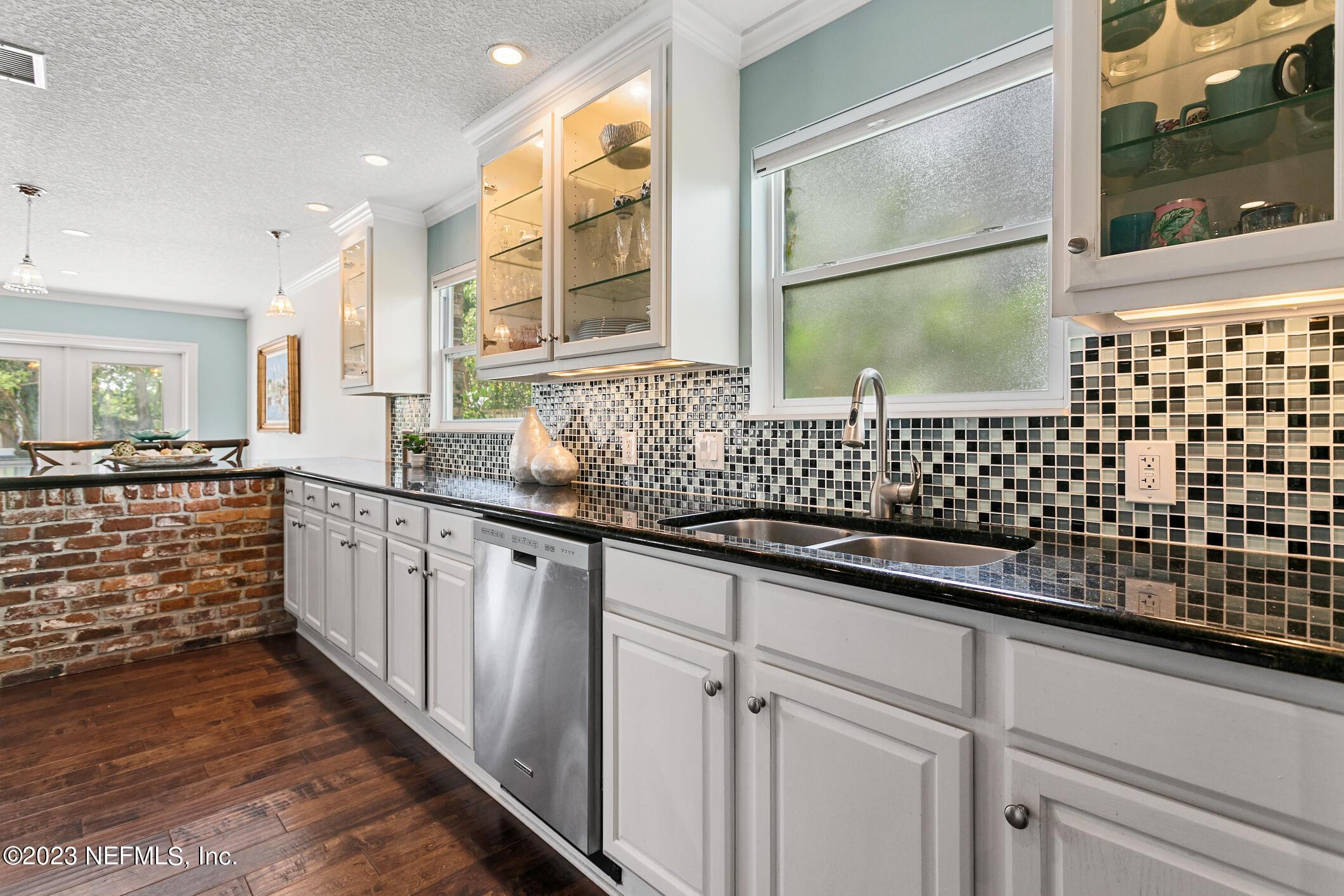 1 Hopson Road Jacksonville Beach, FL 32250 - Photo 12 of 58 a bathroom with a sink a large mirror and a shower