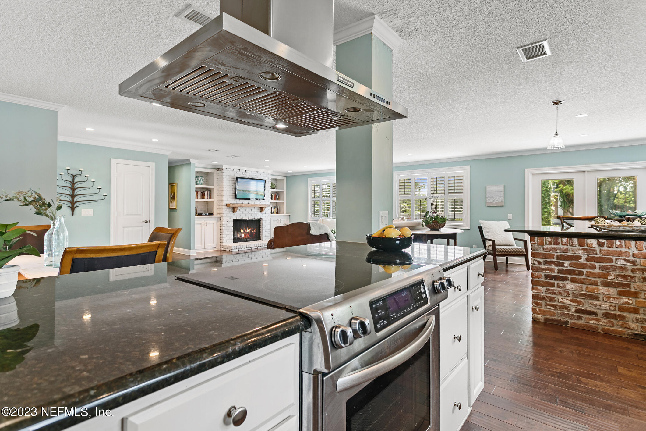 1 Hopson Road Jacksonville Beach, FL 32250 - Photo 14 of 58 a large kitchen with stainless steel appliances granite countertop a lot of counter space and wooden floor