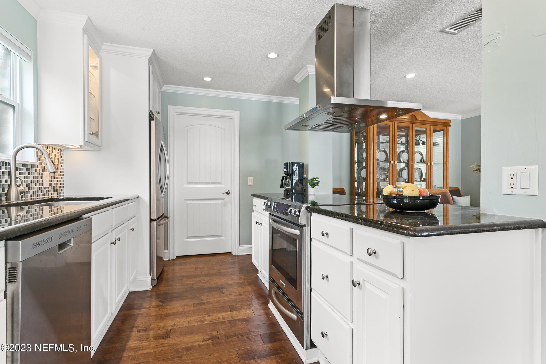 1 Hopson Road Jacksonville Beach, FL 32250 - Photo 15 of 58 a kitchen with stainless steel appliances kitchen island granite countertop a sink and cabinets