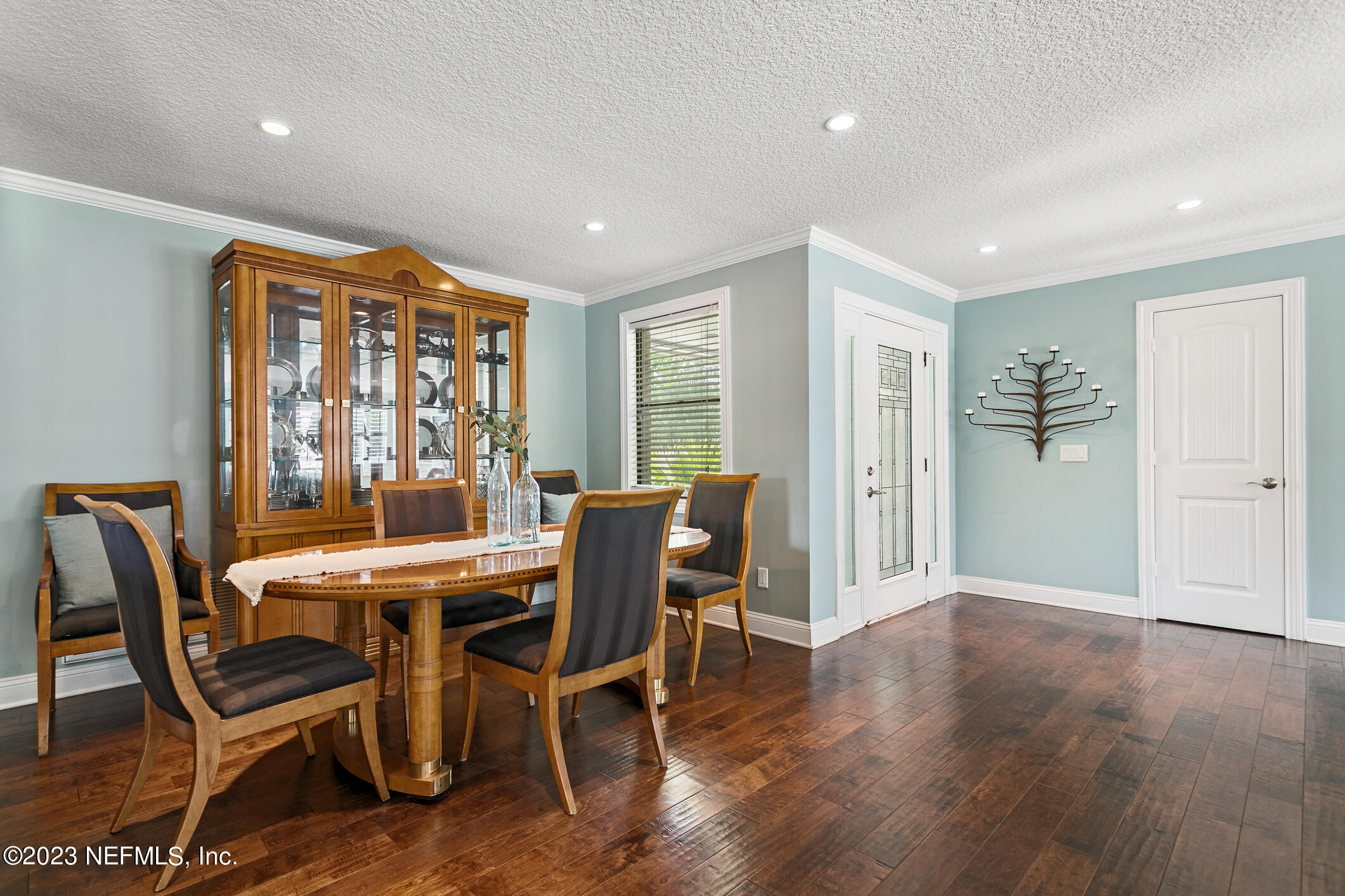 1 Hopson Road Jacksonville Beach, FL 32250 - Photo 17 of 58 a view of a dining room with furniture window and wooden floor