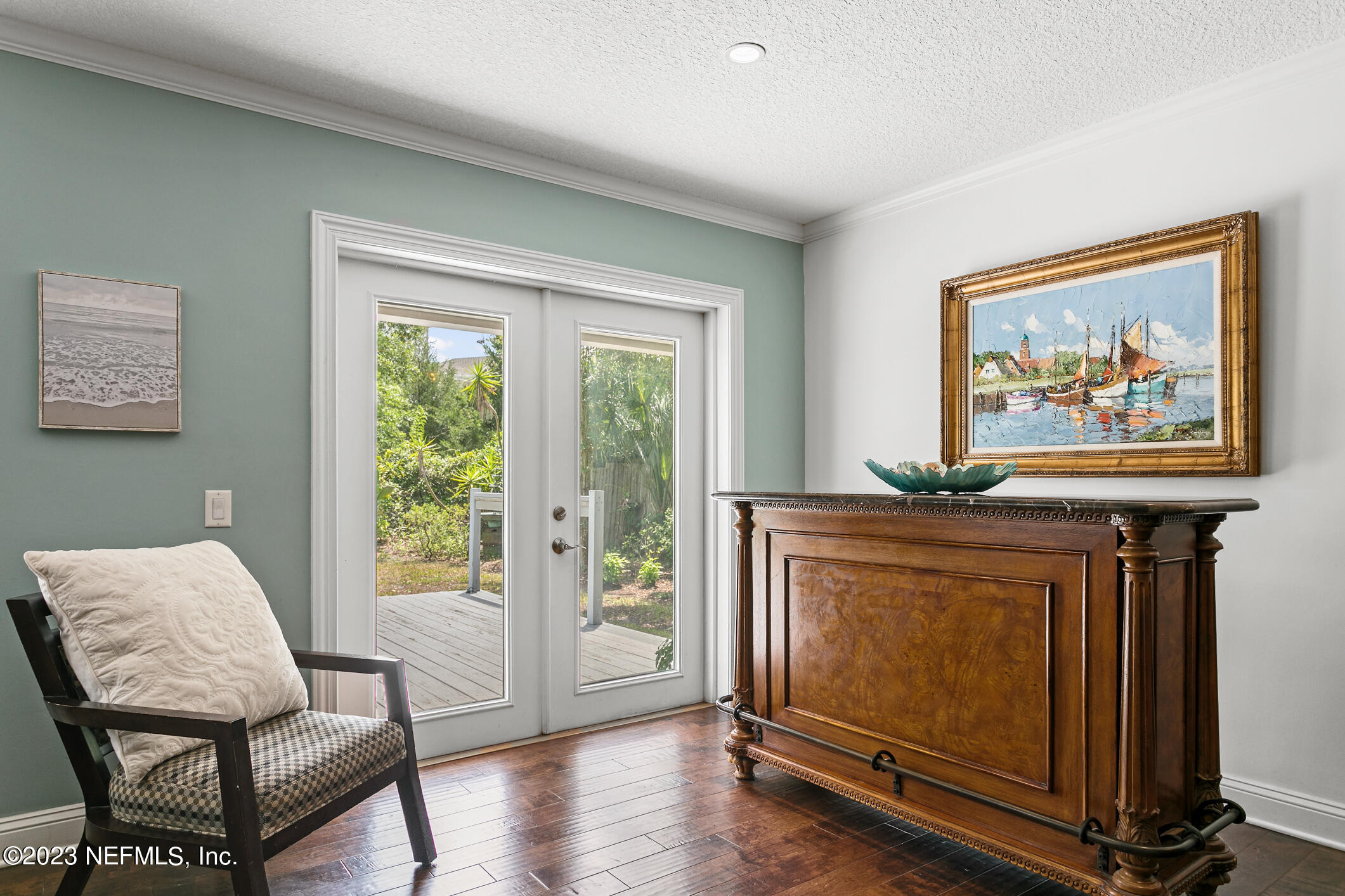 1 Hopson Road Jacksonville Beach, FL 32250 - Photo 19 of 58 a living room with furniture a flat screen tv and a window
