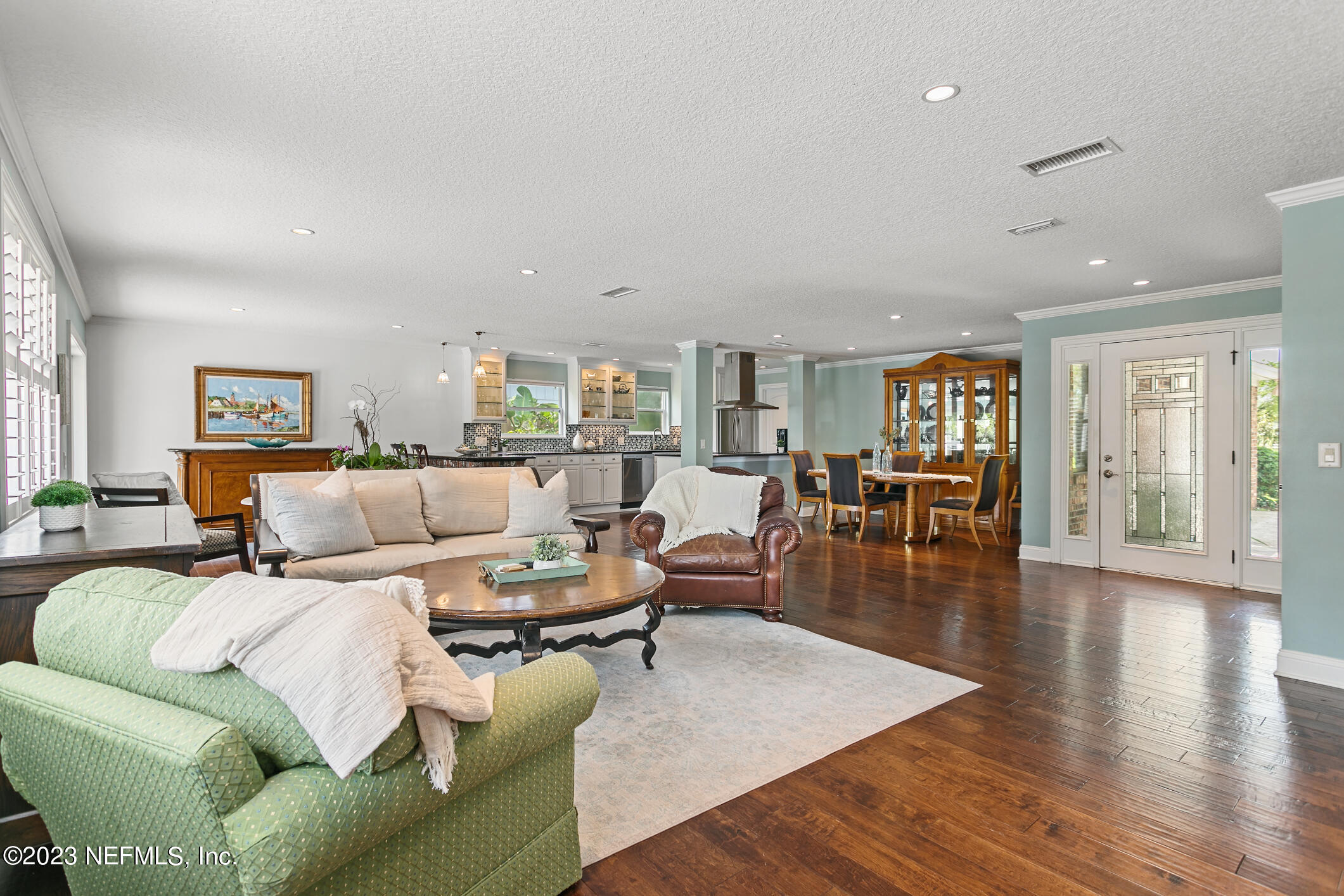 1 Hopson Road Jacksonville Beach, FL 32250 - Photo 22 of 58 a living room with furniture and a wooden floor