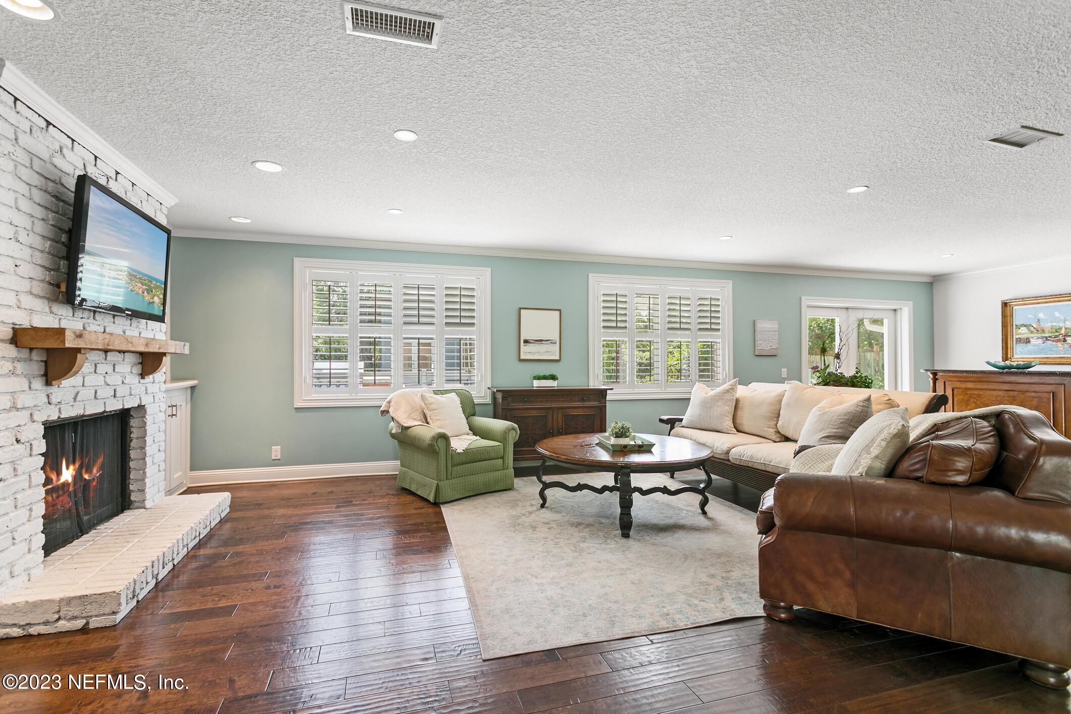 1 Hopson Road Jacksonville Beach, FL 32250 - Photo 23 of 58 a living room with furniture and a fireplace