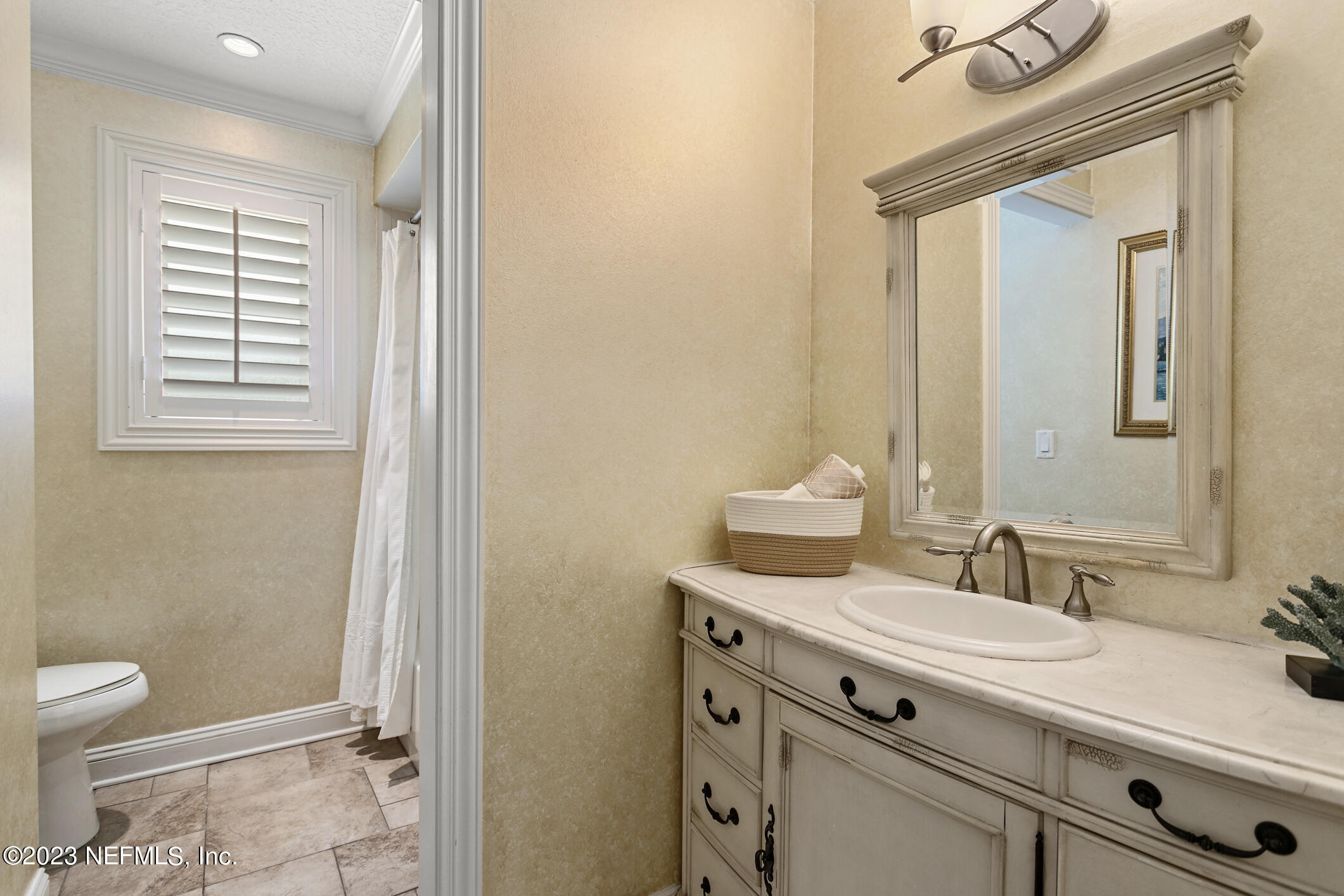 1 Hopson Road Jacksonville Beach, FL 32250 - Photo 28 of 58 a bathroom with a granite countertop sink toilet and shower