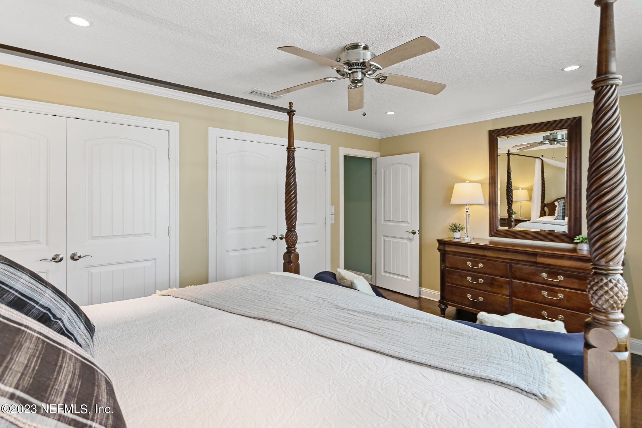 1 Hopson Road Jacksonville Beach, FL 32250 - Photo 31 of 58 a bedroom with a bed and a chandelier