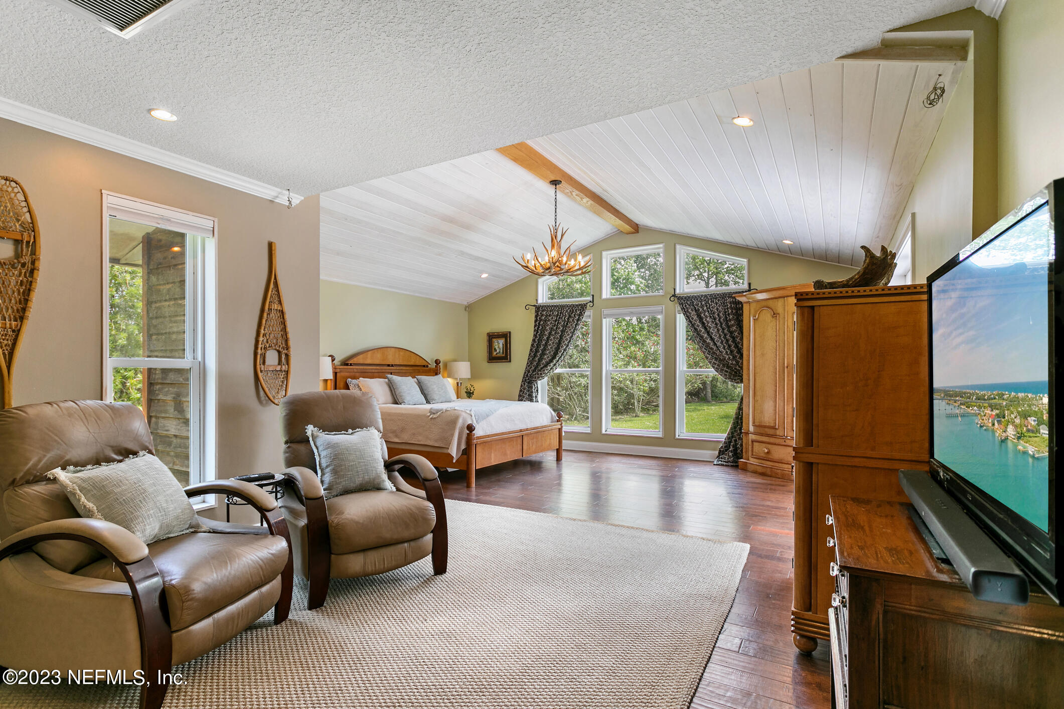 1 Hopson Road Jacksonville Beach, FL 32250 - Photo 32 of 58 a living room with furniture and a flat screen tv