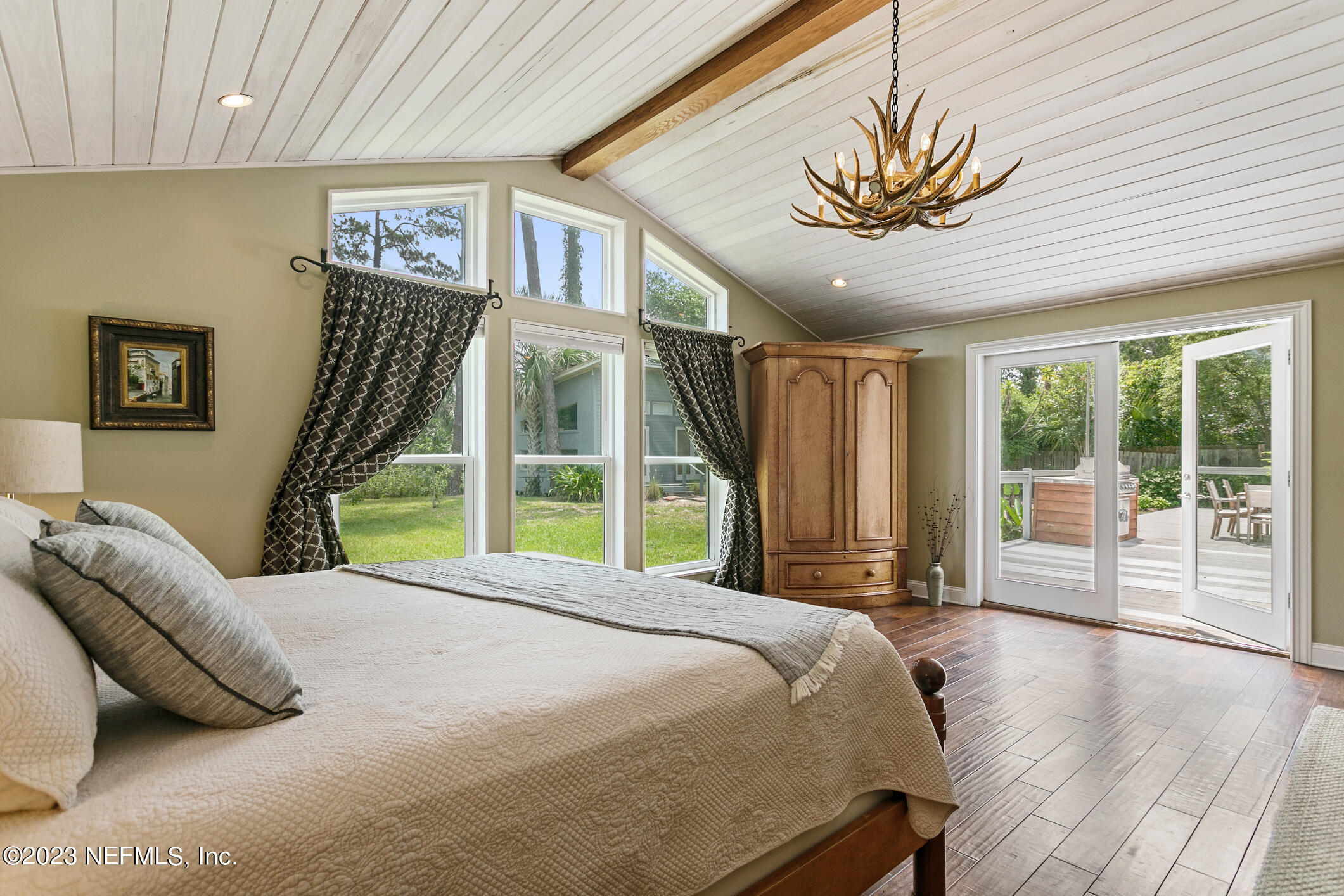 1 Hopson Road Jacksonville Beach, FL 32250 - Photo 37 of 58 a bed sitting in a spacious bedroom next to a window