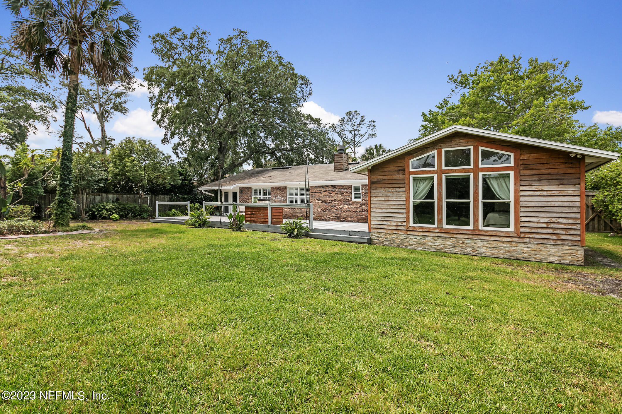 1 Hopson Road Jacksonville Beach, FL 32250 - Photo 42 of 58 a front view of a house with a yard