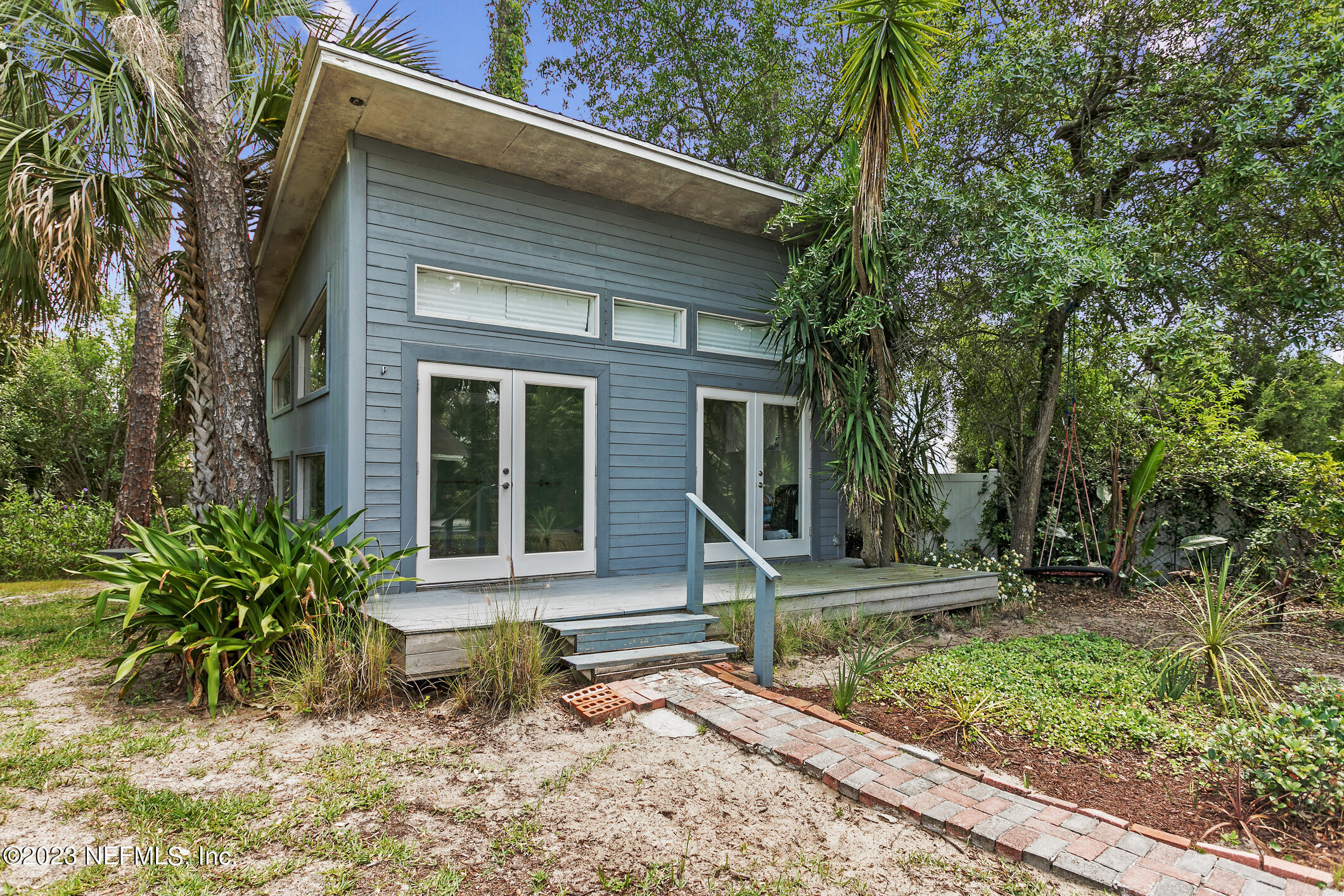 1 Hopson Road Jacksonville Beach, FL 32250 - Photo 43 of 58 a front view of a house with garden
